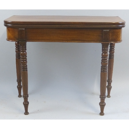 A Victorian mahogany fold over tea table