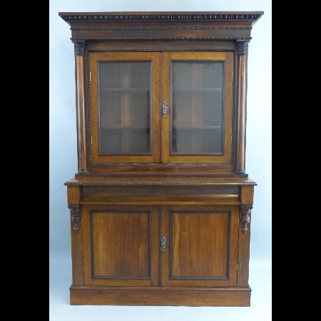 A 19th Century rosewood bookcase on cabinet