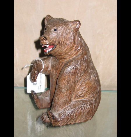 A sitting carved wood Black Forest Bear