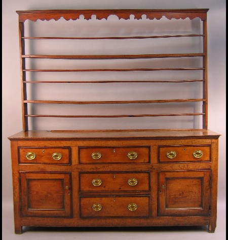 An 18th Century elm dresser and rack